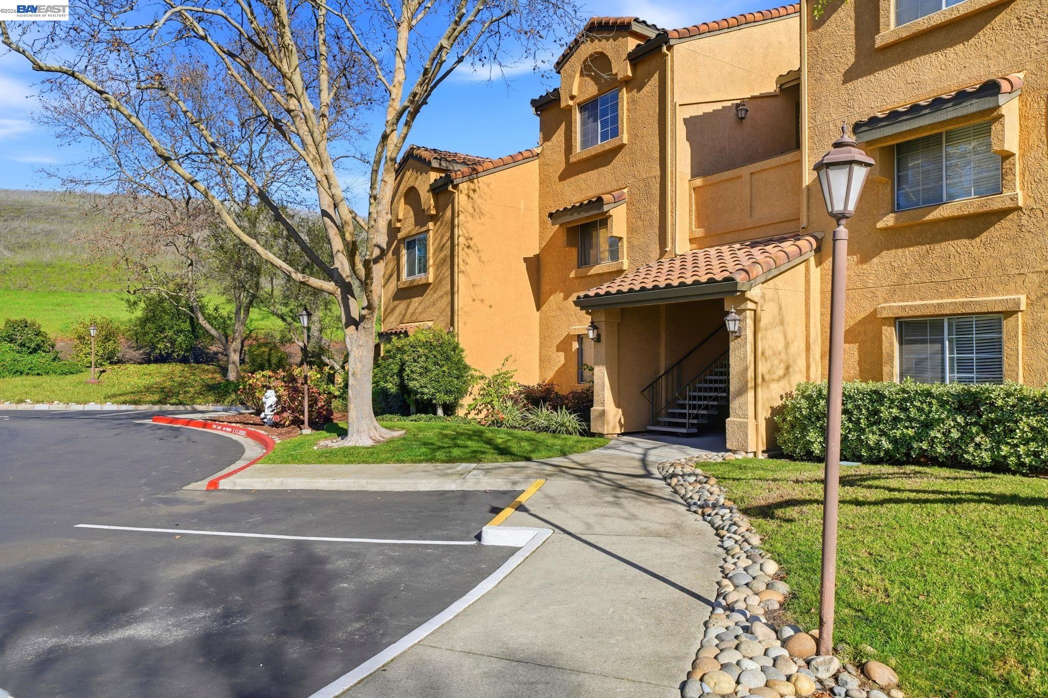 490 Bollinger Canyon Lane, Unit 367 San Ramon, CA 94582 - Photo 3 of 32 a view of a building with cars parked on road