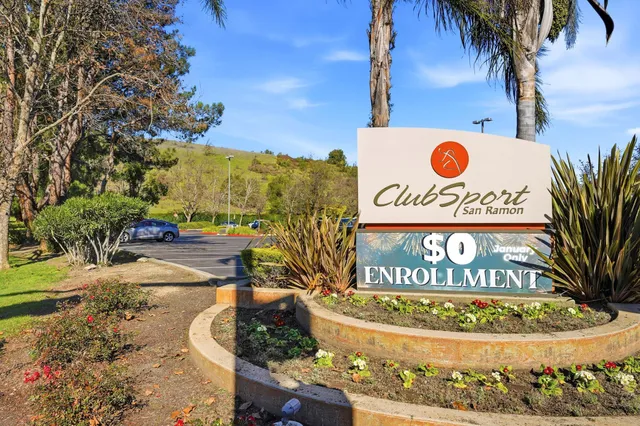 a view of outdoor space with signage and flags