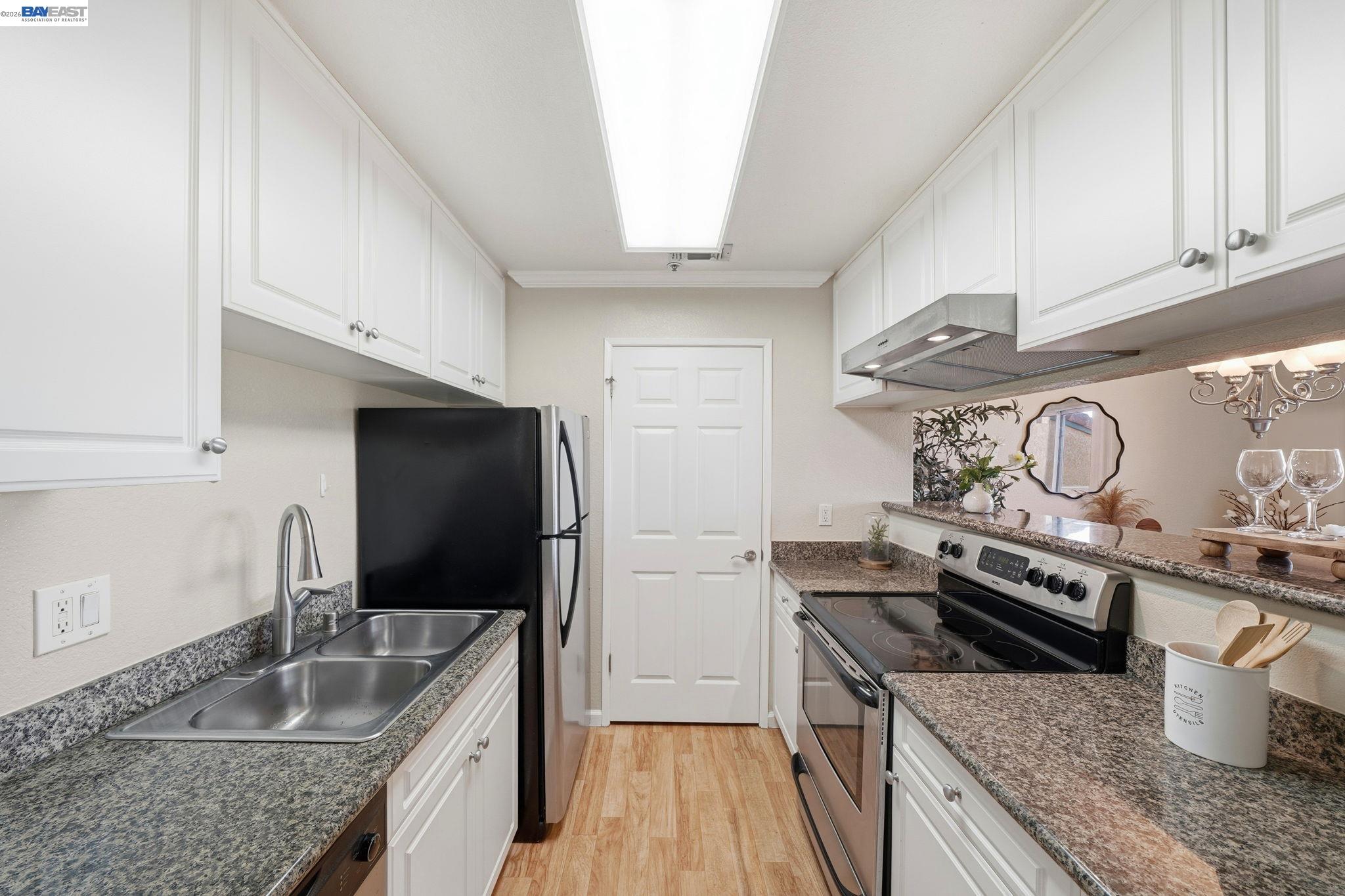 490 Bollinger Canyon Lane, Unit 367 San Ramon, CA 94582 - Photo 8 of 32 a kitchen with a stove and a sink