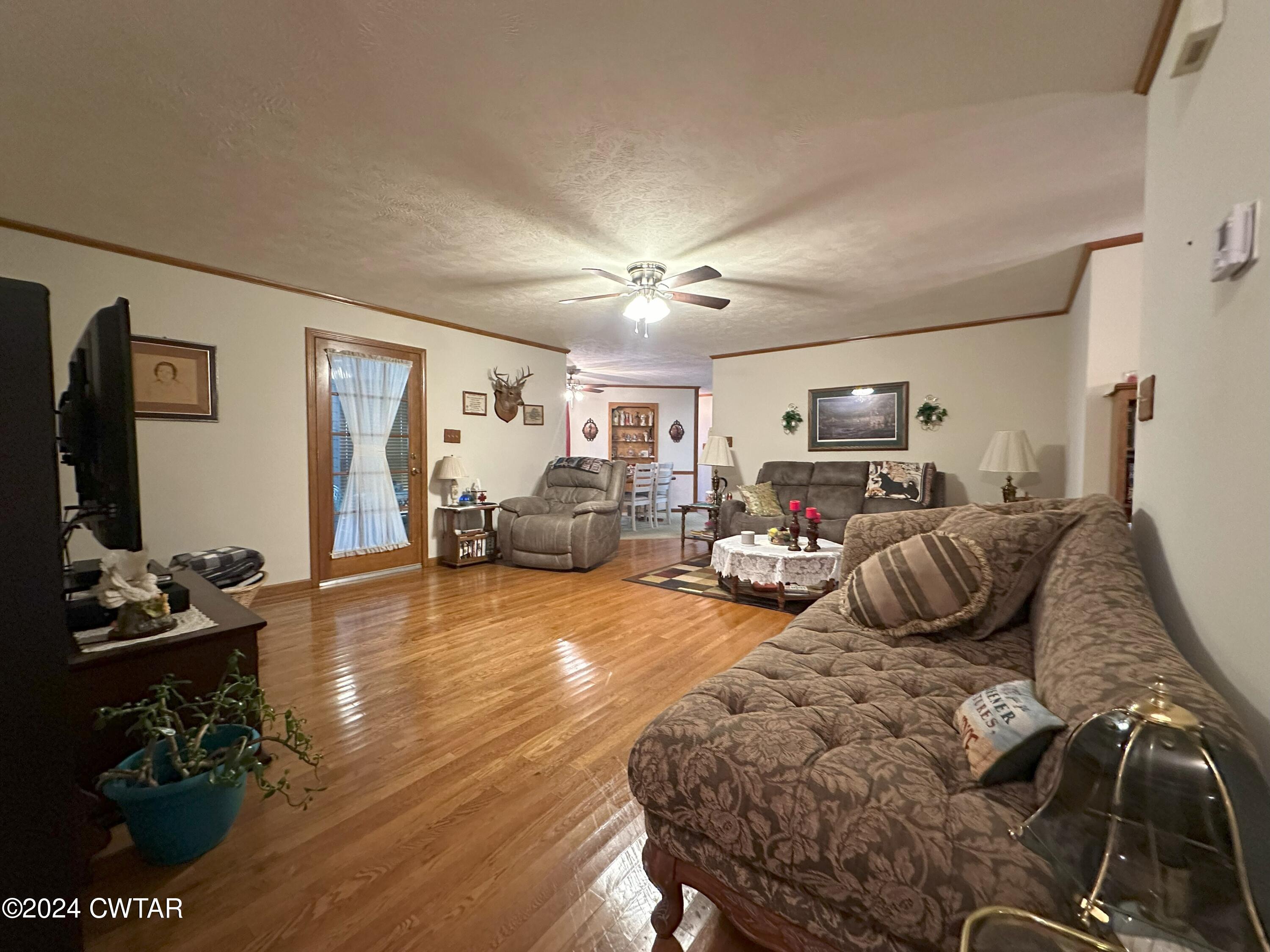 883 Crucifer Road Huron, TN 38345 - Photo 16 of 22 a bedroom with furniture a flat screen tv and a window