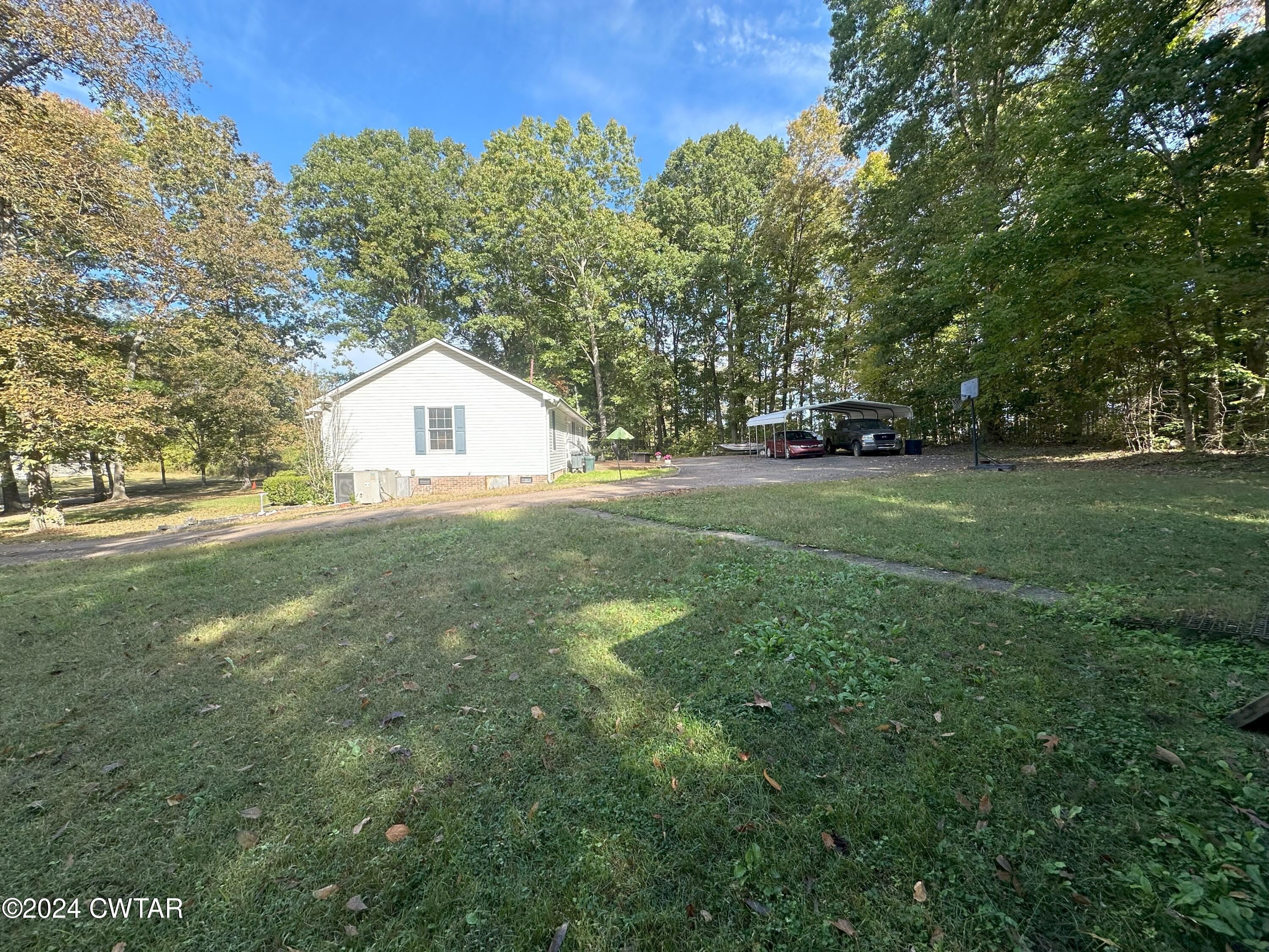883 Crucifer Road Huron, TN 38345 - Photo 7 of 22 a view of a house with a yard