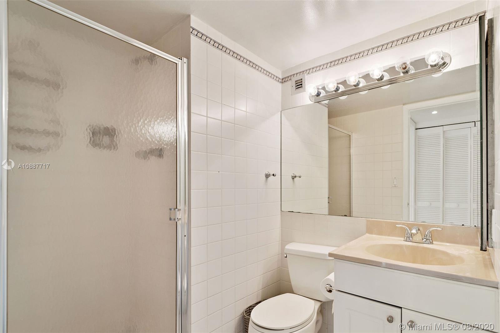 1450 Brickell Bay Drive, Unit 612 Miami, FL 33131 - Photo 20 of 25 a bathroom with a sink toilet tub and shower
