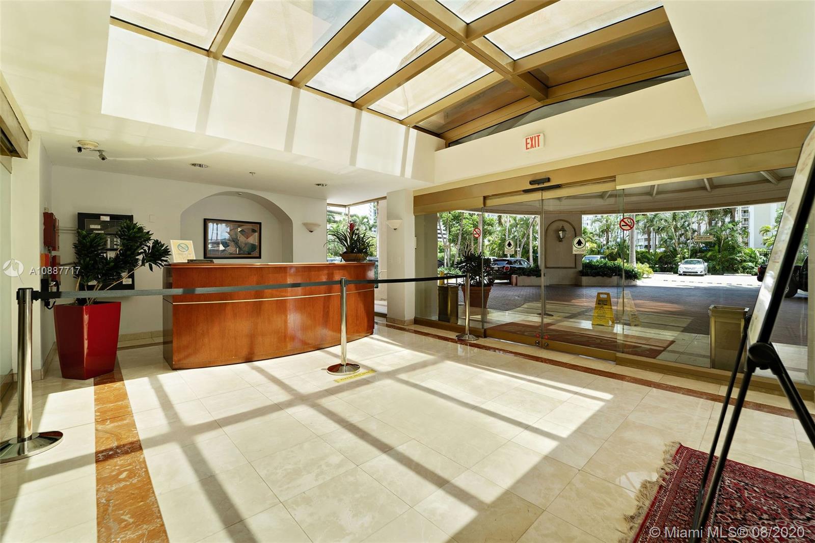 1450 Brickell Bay Drive, Unit 612 Miami, FL 33131 - Photo 21 of 25 a view of a kitchen with stainless steel appliances kitchen island granite countertop a sink and cabinets