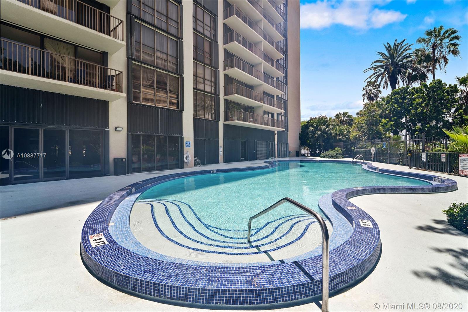 1450 Brickell Bay Drive, Unit 612 Miami, FL 33131 - Photo 23 of 25 a view of a swimming pool with a sitting space