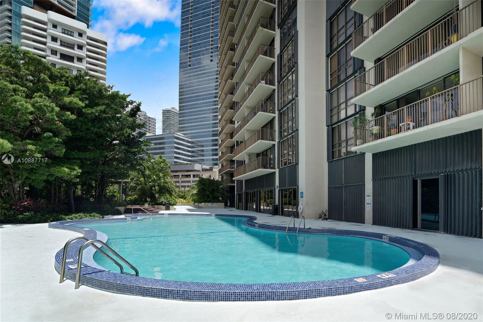 1450 Brickell Bay Drive, Unit 612 Miami, FL 33131 - Photo 24 of 25 a view of a house with a swimming pool