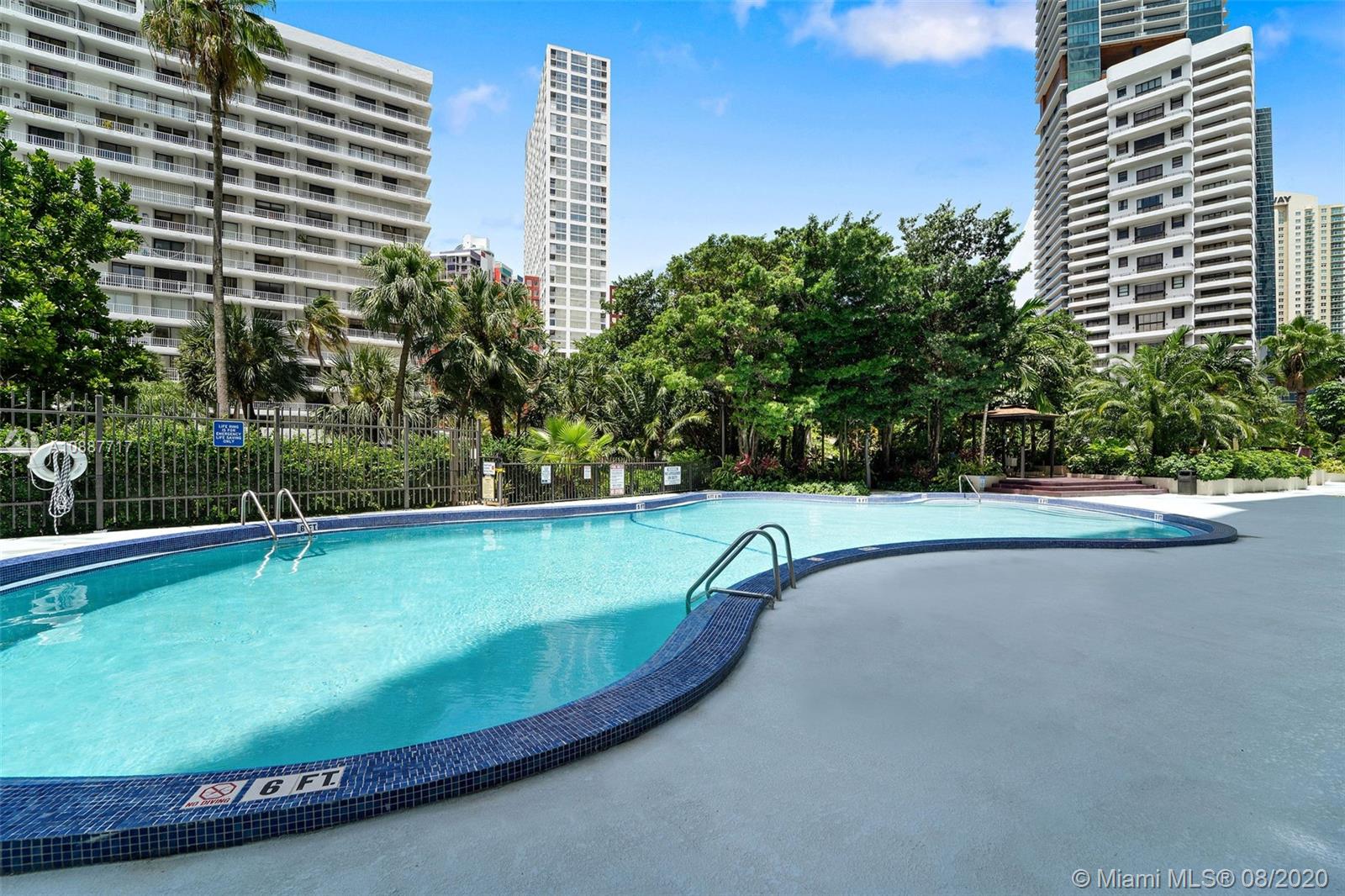 1450 Brickell Bay Drive, Unit 612 Miami, FL 33131 - Photo 25 of 25 a view of a swimming pool with a yard