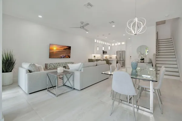 a living room with fireplace furniture and a flat screen tv