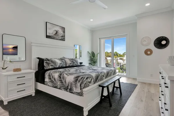 a bedroom with a bed and a dresser