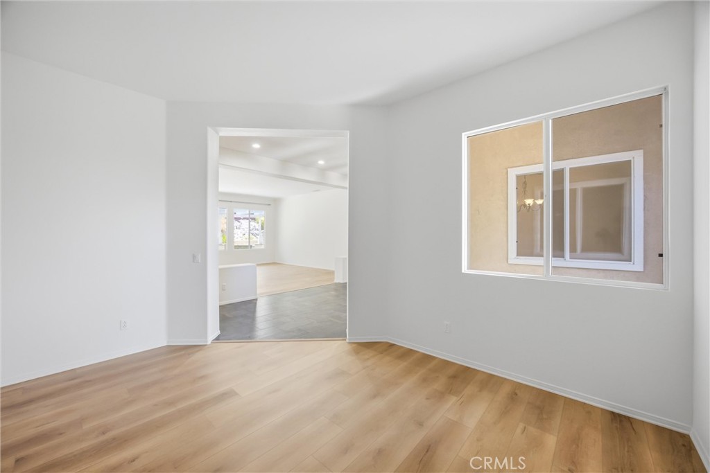 8710 Windmill Place Riverside, CA 92508 - Photo 12 of 66 a view of empty room with wooden floor and fan