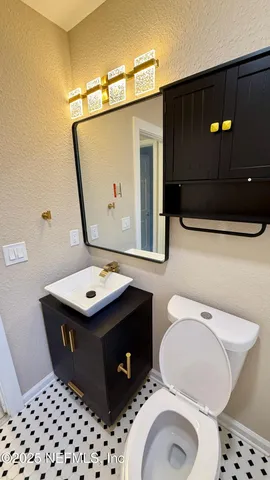 a bathroom with a toilet and a sink