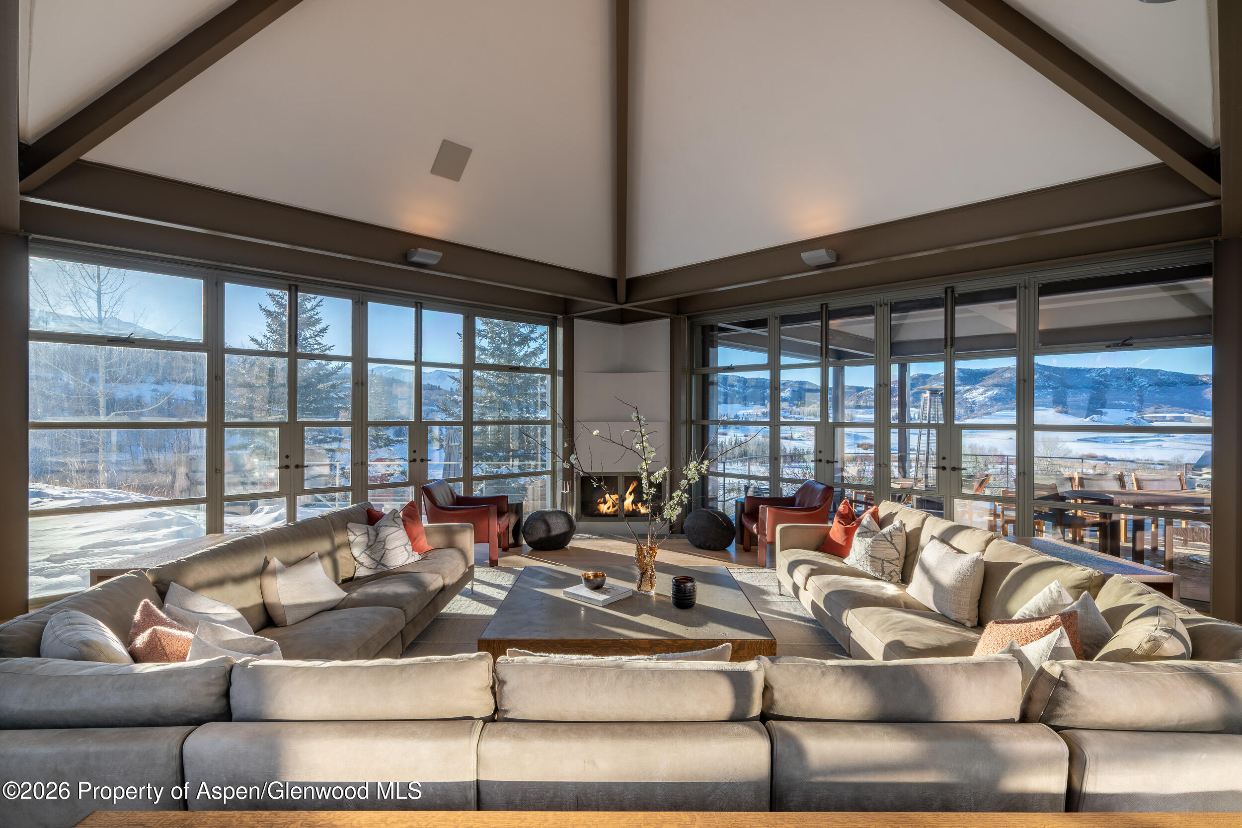 821 Cluny Road Aspen, CO 81611 - Photo 11 of 27 a living room with furniture and floor to ceiling windows