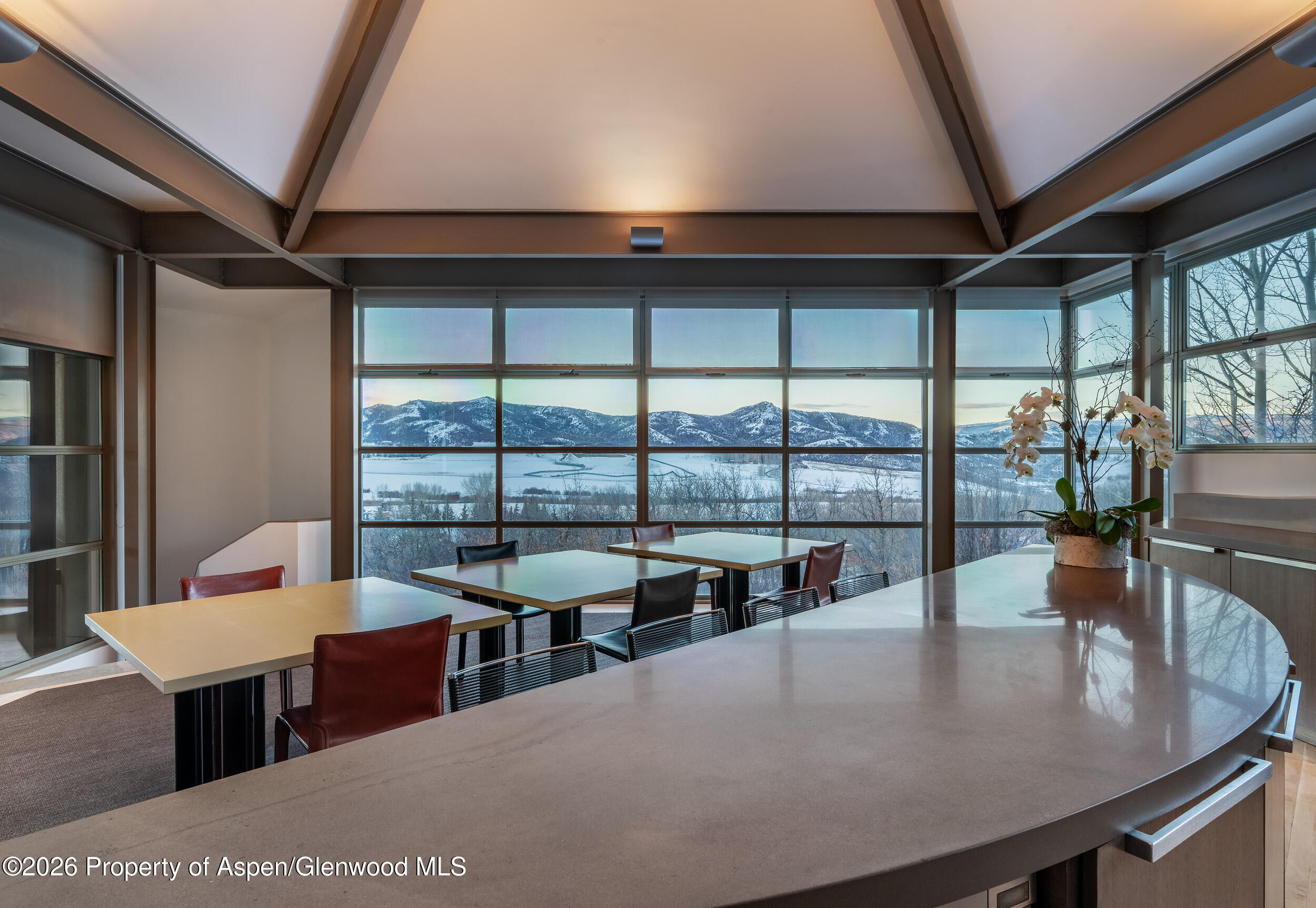 821 Cluny Road Aspen, CO 81611 - Photo 16 of 27 a dining room with furniture and a floor to ceiling window