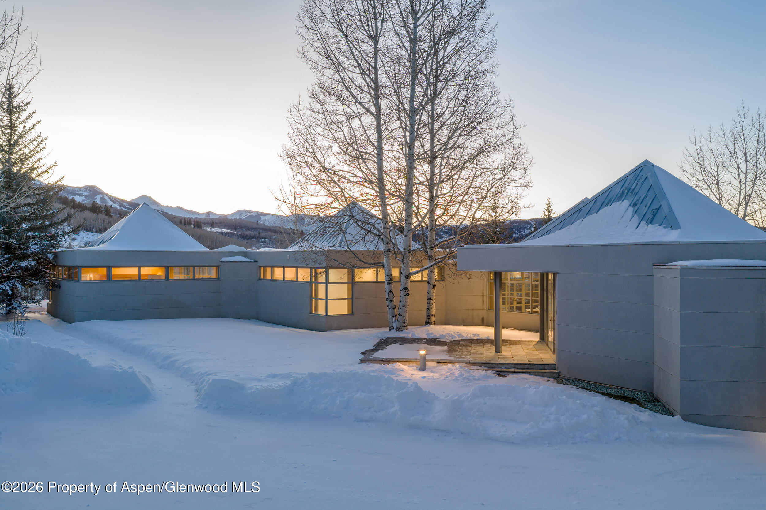 821 Cluny Road Aspen, CO 81611 - Photo 7 of 27 a view of house with a yard and large tree