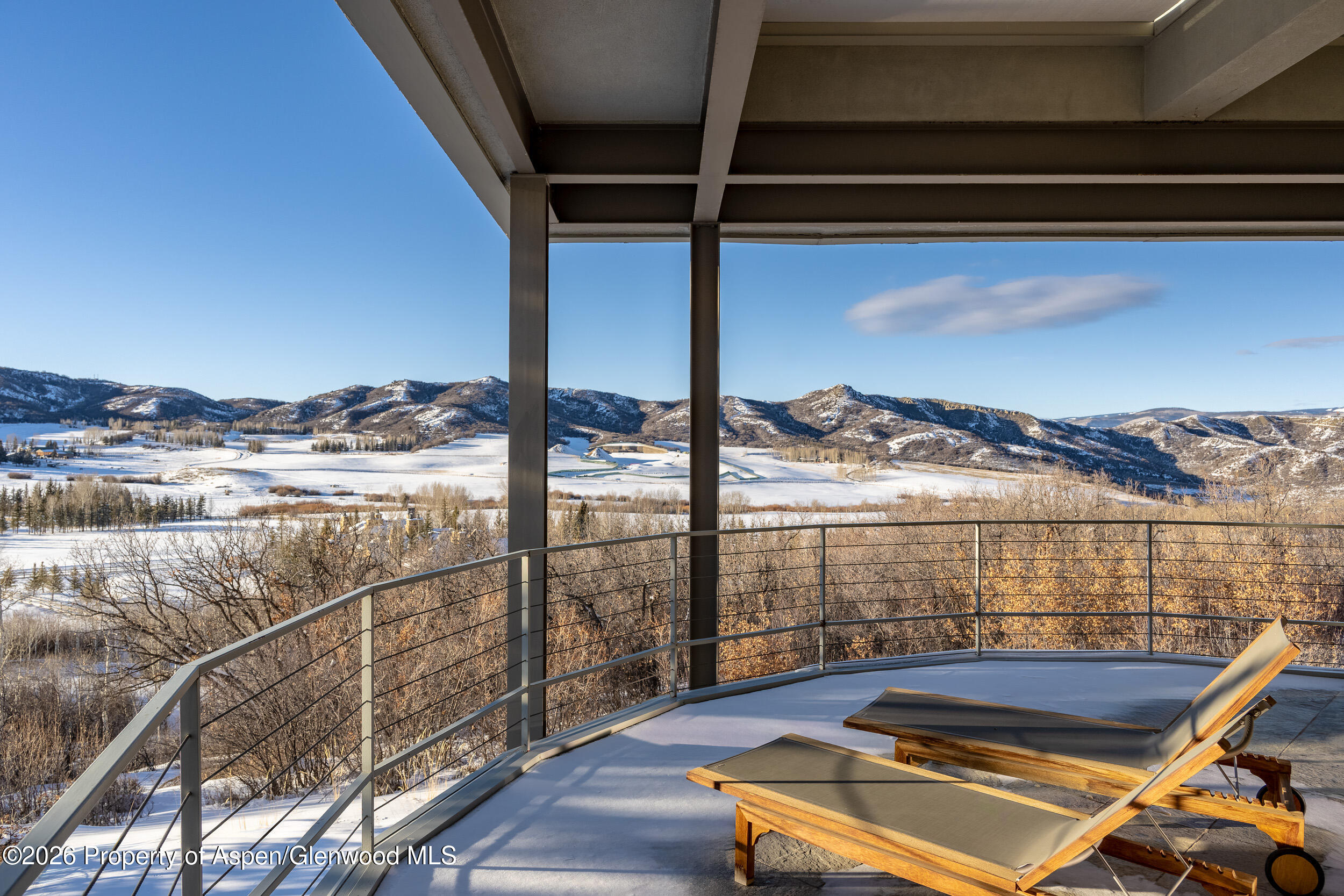 821 Cluny Road Aspen, CO 81611 - Photo 8 of 27 a view of a balcony with chair and table