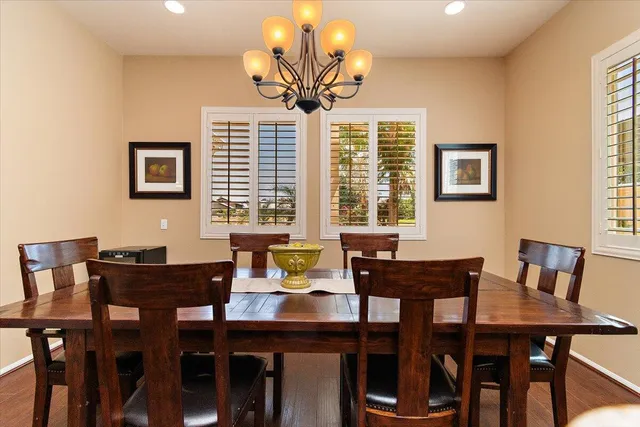 a view of a dining room with furniture and window