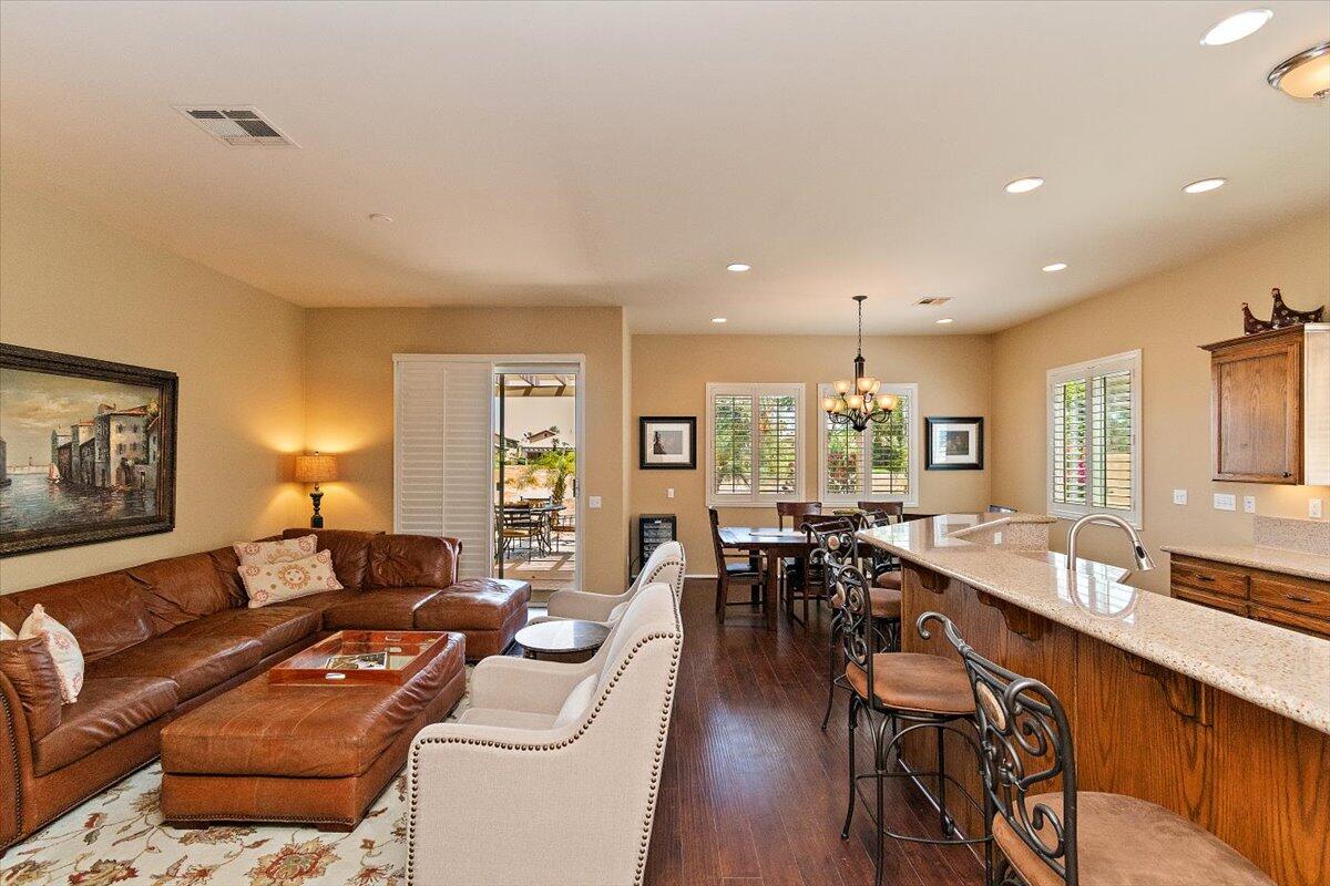 49580 Wayne Street Indio, CA 92201 - Photo 18 of 37 a living room with furniture a dining table and chairs
