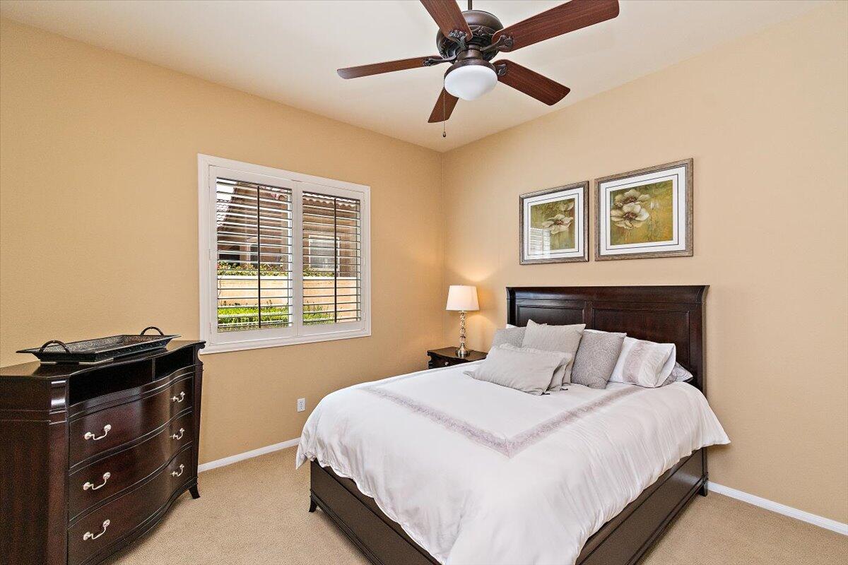 49580 Wayne Street Indio, CA 92201 - Photo 25 of 37 a bedroom with a bed and a window