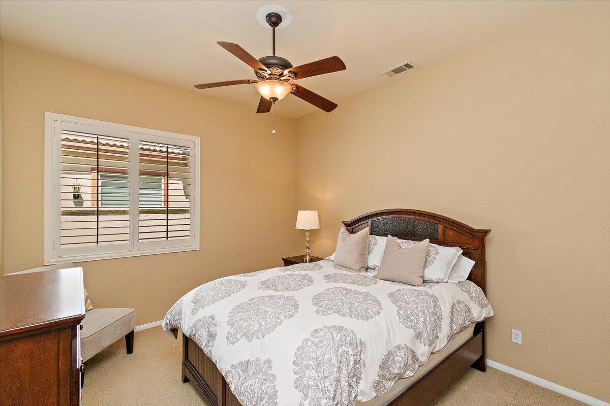 49580 Wayne Street Indio, CA 92201 - Photo 27 of 37 a bedroom with a bed and a window