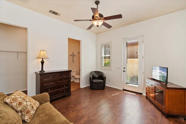 a bedroom with furniture and a window