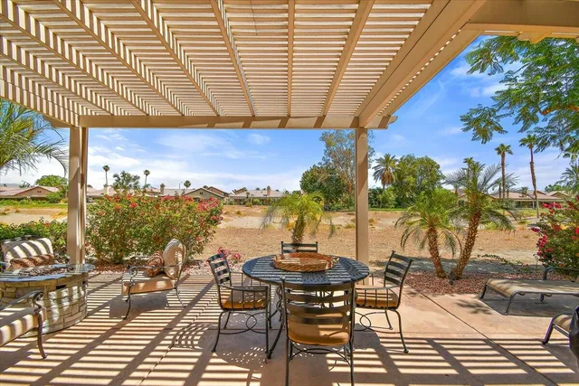 a view of a chairs and table in the patio