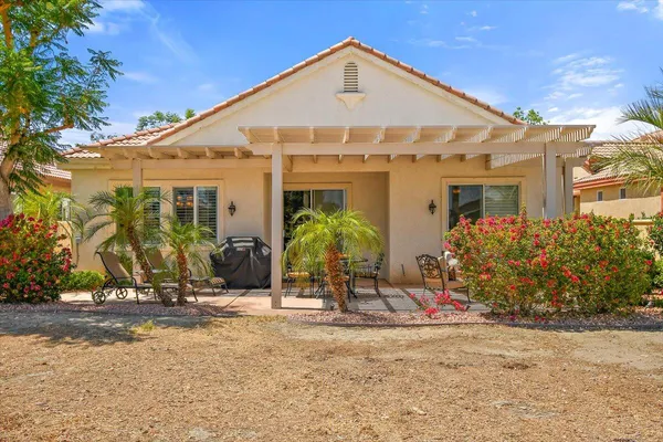front view of a house with potted plants