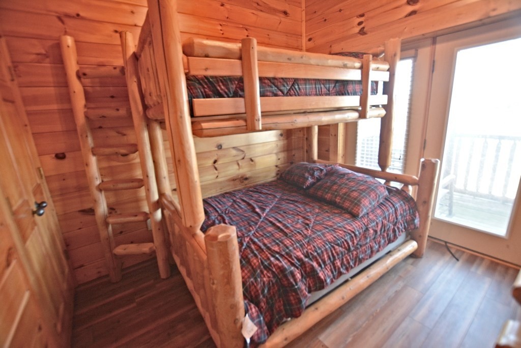 1728 Summit View Way Sevierville, TN 37862 - Photo 27 of 36 a bed sitting in a bedroom next to a window