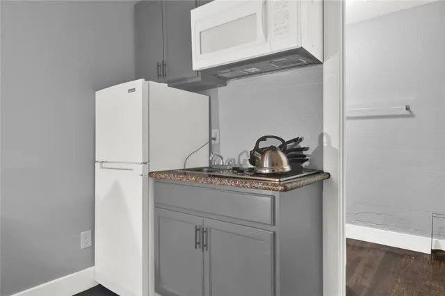 a bathroom with a sink a toilet and bathtub