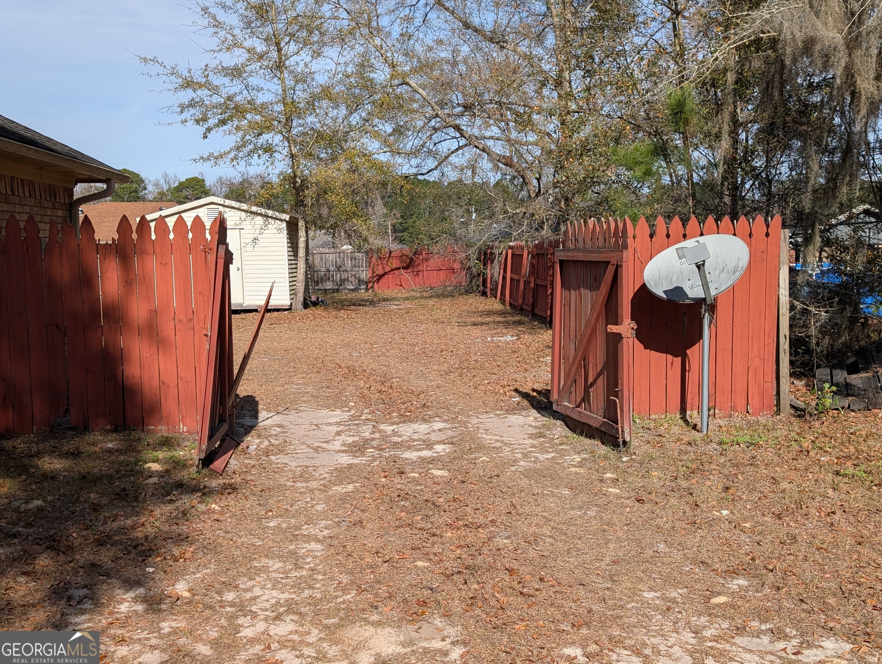 1934 Talmadge Road Allenhurst, GA 31301 - Photo 2 of 19 a backyard of a house with portable table and chairs