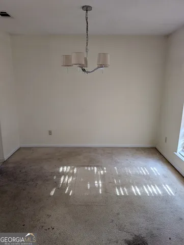a view of a room with an empty space