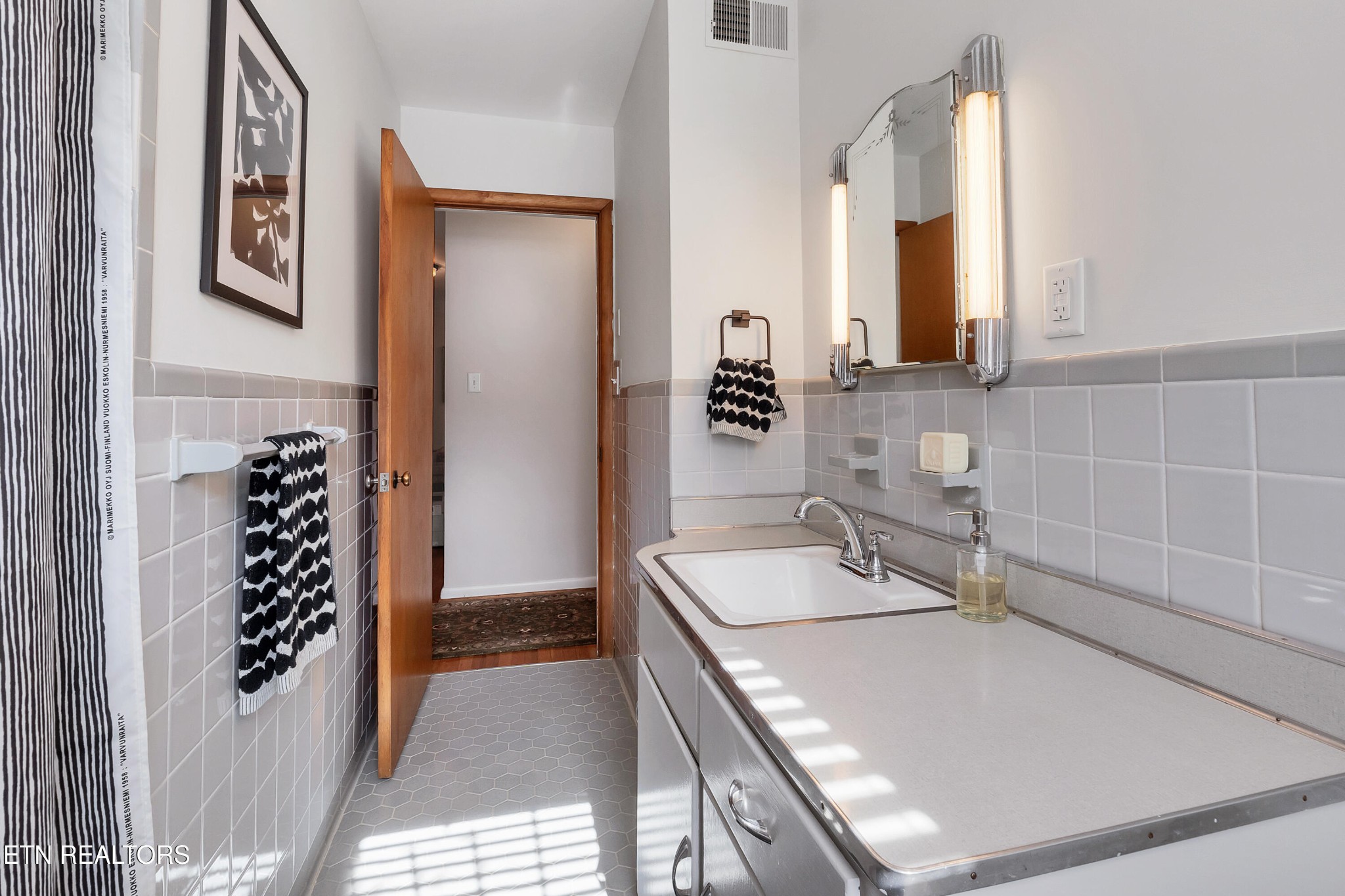 409 Bridge View Lane Knoxville, TN 37914 - Photo 23 of 37 a bathroom with a granite countertop sink and a mirror