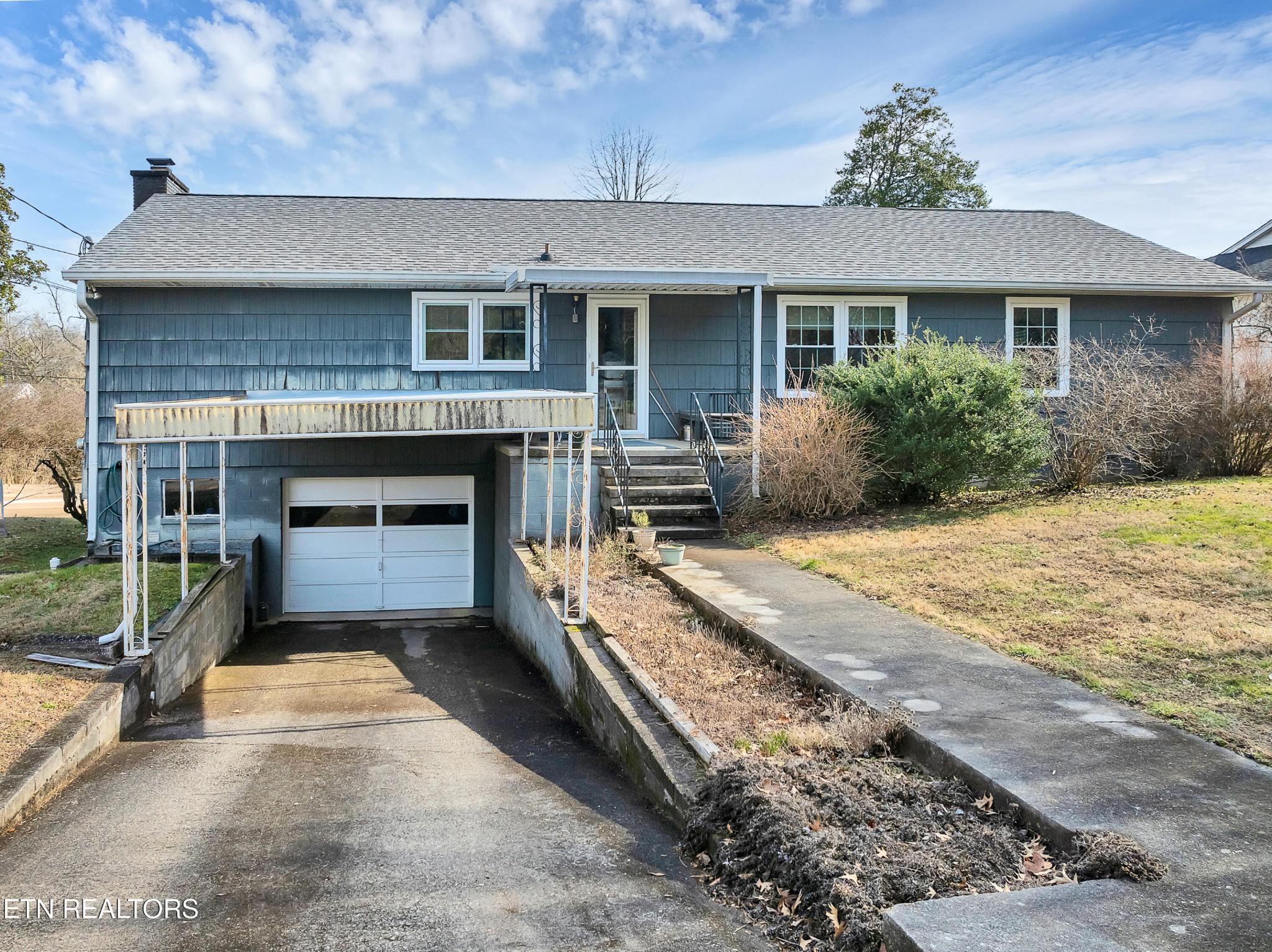 409 Bridge View Lane Knoxville, TN 37914 - Photo 32 of 37 a front view of a house with yard space and parking
