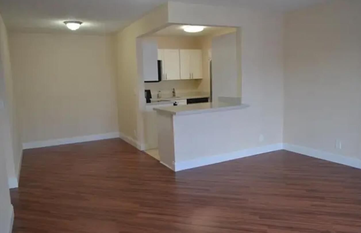 6800 Northeast 22nd Way, Unit 2121 Fort Lauderdale, FL 33308 - Photo 3 of 8 a kitchen with wooden floor and a sink