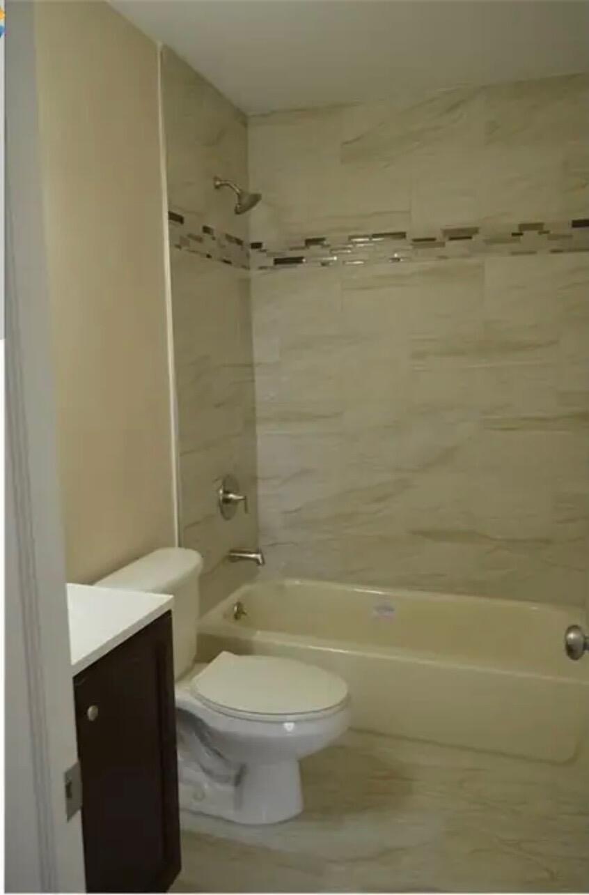 6800 Northeast 22nd Way, Unit 2121 Fort Lauderdale, FL 33308 - Photo 4 of 8 a bathroom with a toilet a sink and shower