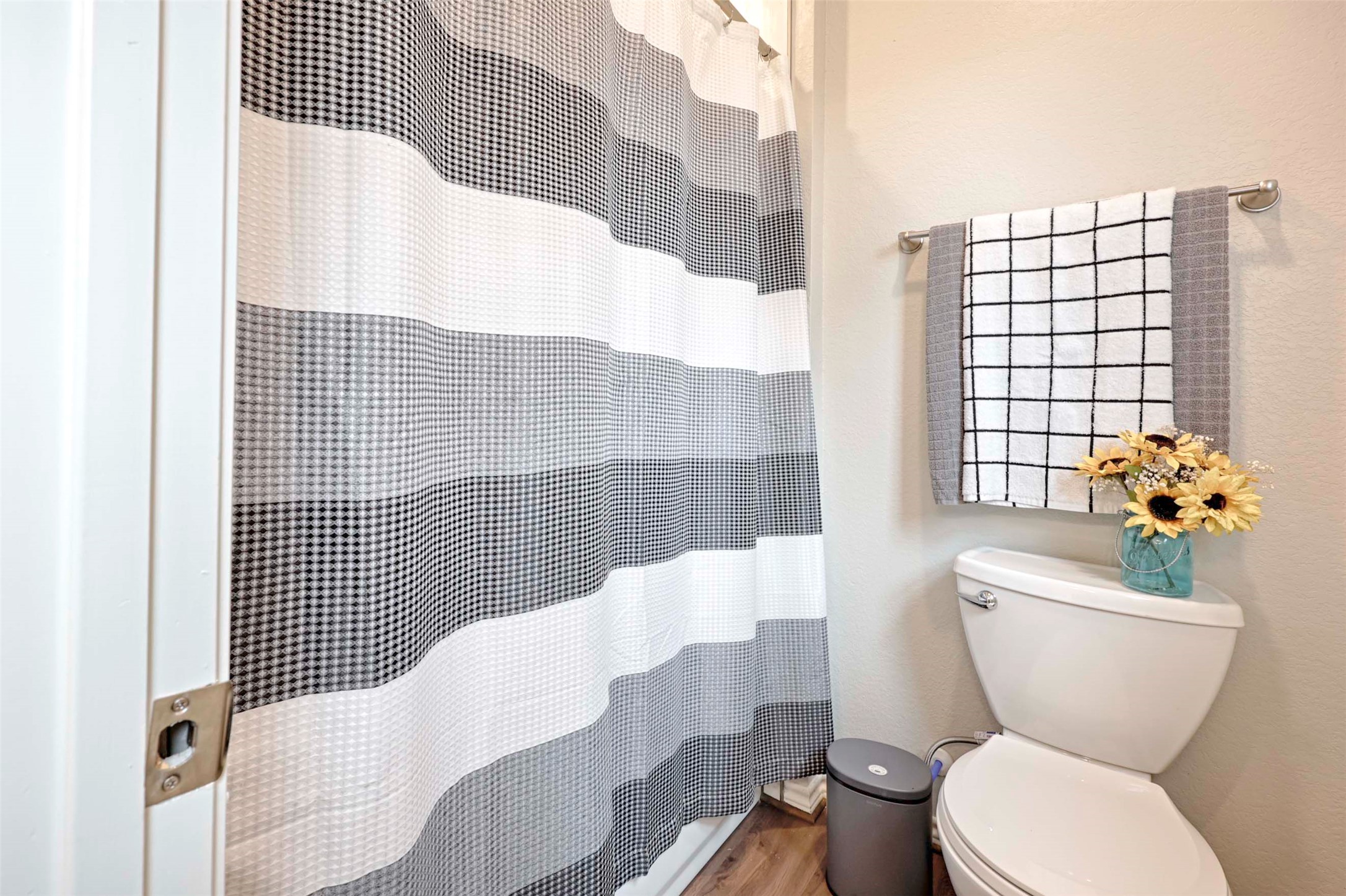 206 East Hinton Road Weimar, TX 78962 - Photo 17 of 22 Full bathroom featuring a shower with curtain and light wood-style floors