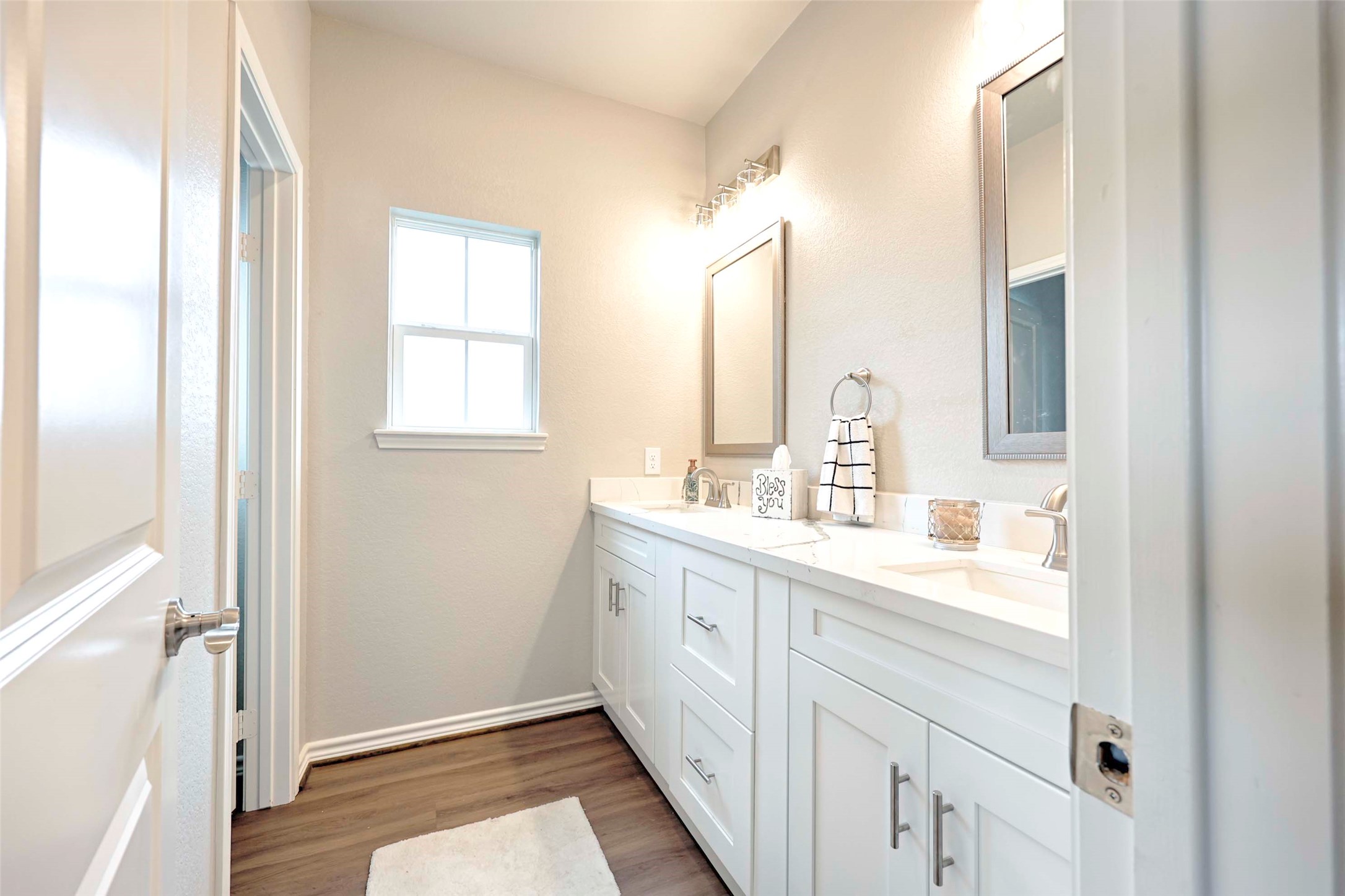 206 East Hinton Road Weimar, TX 78962 - Photo 18 of 22 Bathroom featuring double vanity and dark wood-style floors
