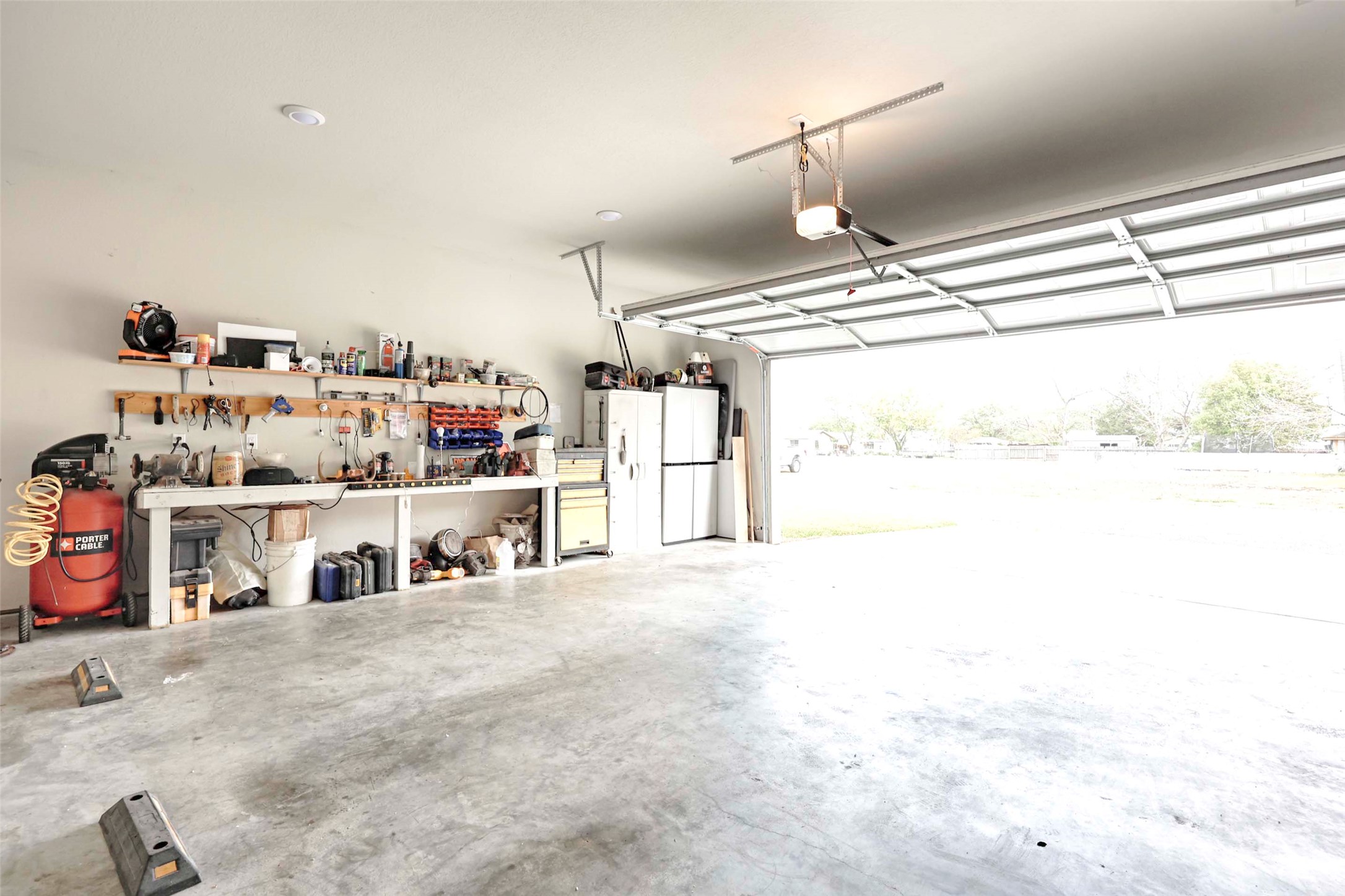 206 East Hinton Road Weimar, TX 78962 - Photo 20 of 22 Garage with a workshop area