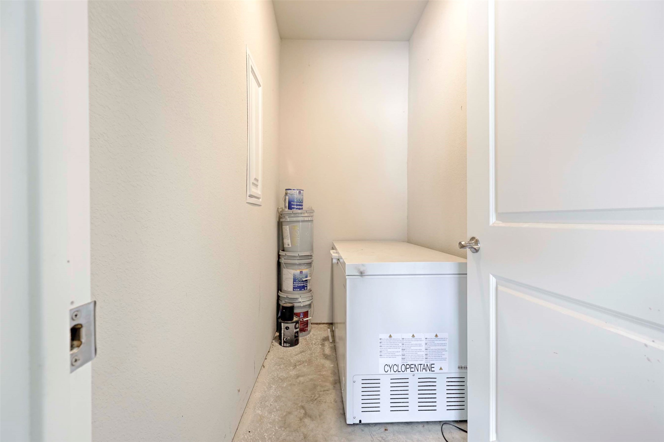 206 East Hinton Road Weimar, TX 78962 - Photo 22 of 22 Laundry room with unfinished concrete flooring and a textured wall