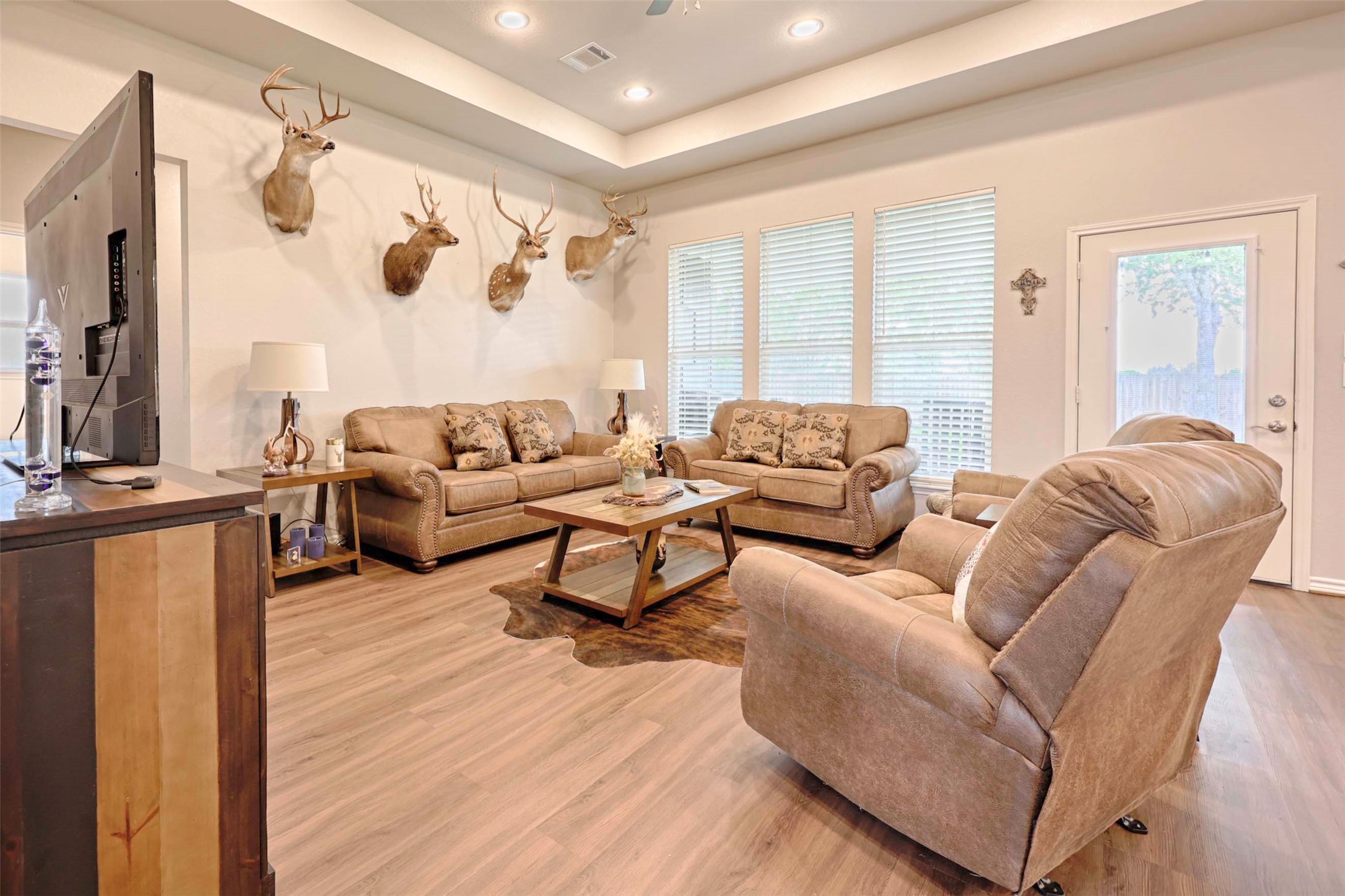 206 East Hinton Road Weimar, TX 78962 - Photo 10 of 22 Living area with a raised ceiling, light wood-style floors, and recessed lighting