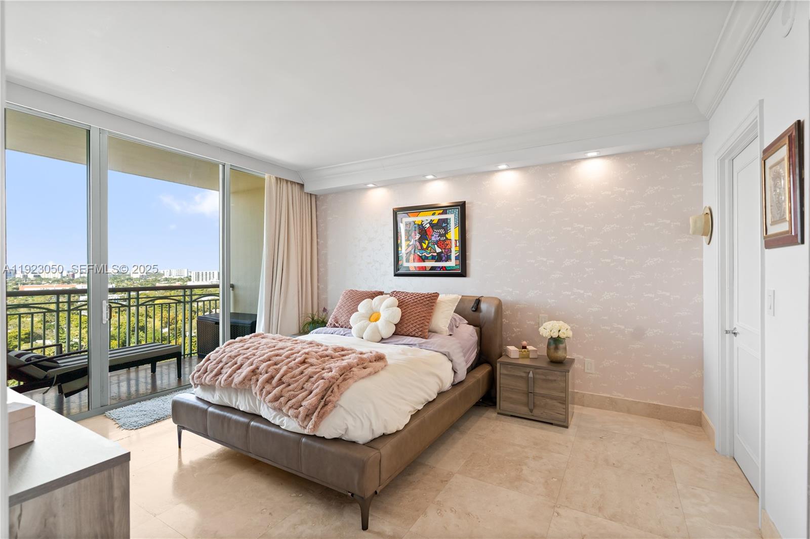 3350 Southwest 27th Avenue, Unit 1706 Coconut Grove, FL 33133 - Photo 12 of 32 a bedroom with a bed and glass door