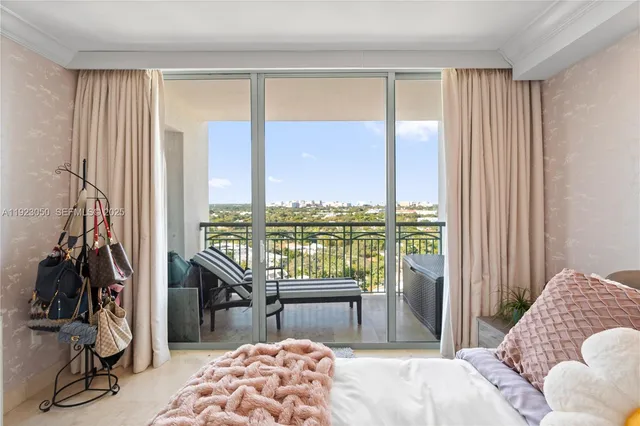 a view of a hallway with couch and dining area