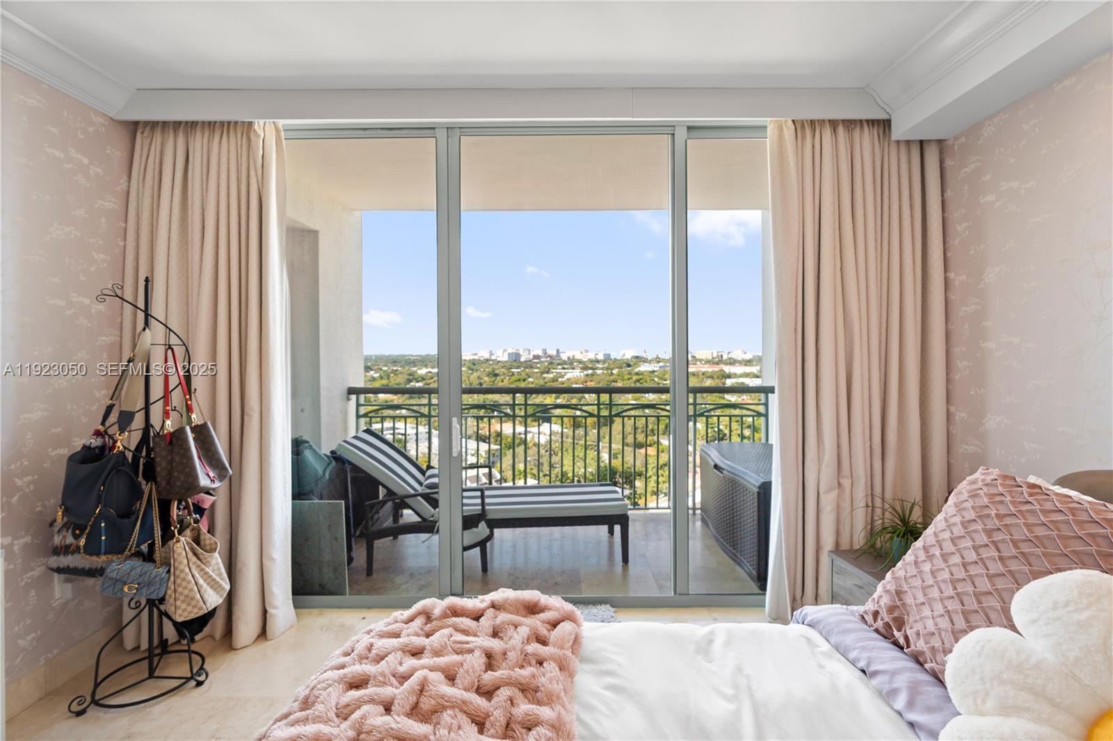 3350 Southwest 27th Avenue, Unit 1706 Coconut Grove, FL 33133 - Photo 13 of 32 a bedroom with furniture and a window