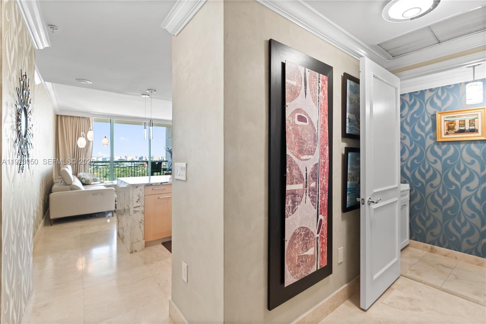 3350 Southwest 27th Avenue, Unit 1706 Coconut Grove, FL 33133 - Photo 14 of 32 a view of a hallway with couch and dining area