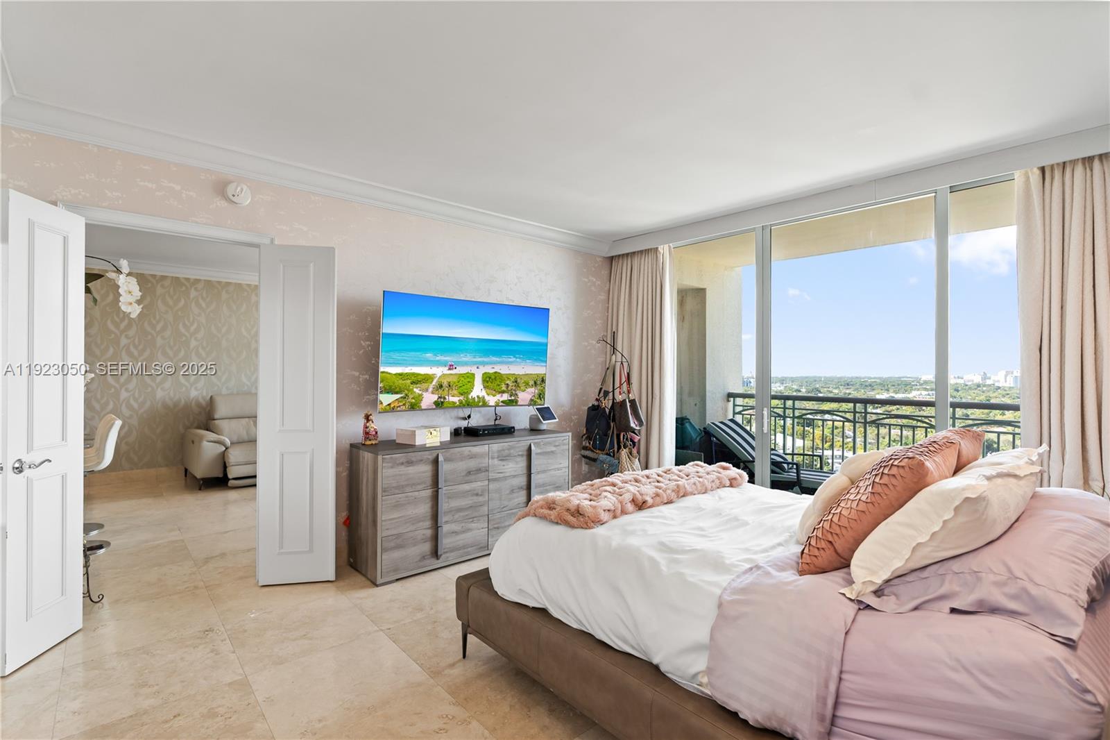 3350 Southwest 27th Avenue, Unit 1706 Coconut Grove, FL 33133 - Photo 15 of 32 a bedroom with a bed and a large window