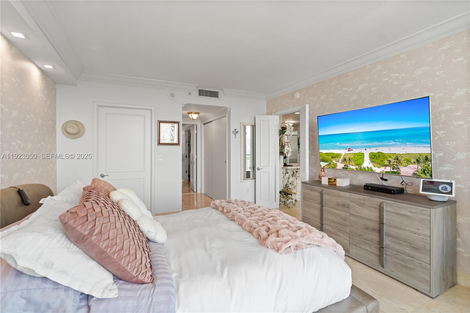 3350 Southwest 27th Avenue, Unit 1706 Coconut Grove, FL 33133 - Photo 16 of 32 a bedroom with a bed and a large window