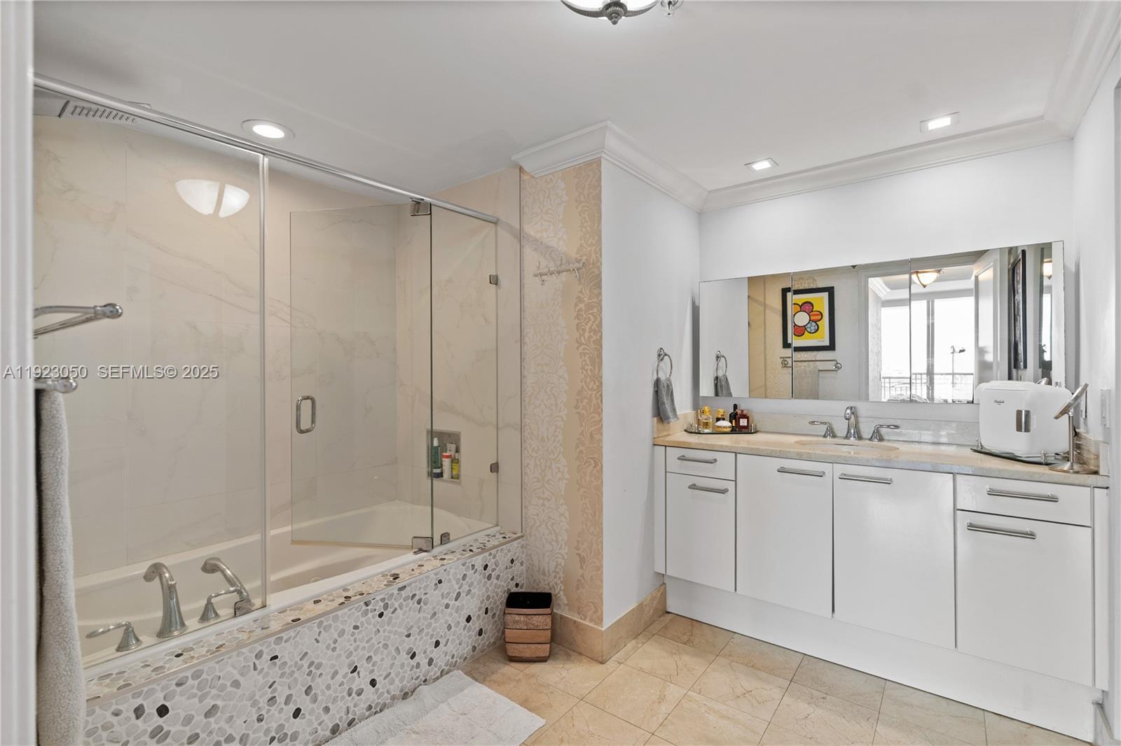 3350 Southwest 27th Avenue, Unit 1706 Coconut Grove, FL 33133 - Photo 18 of 32 a bathroom with a double vanity sink toilet and shower