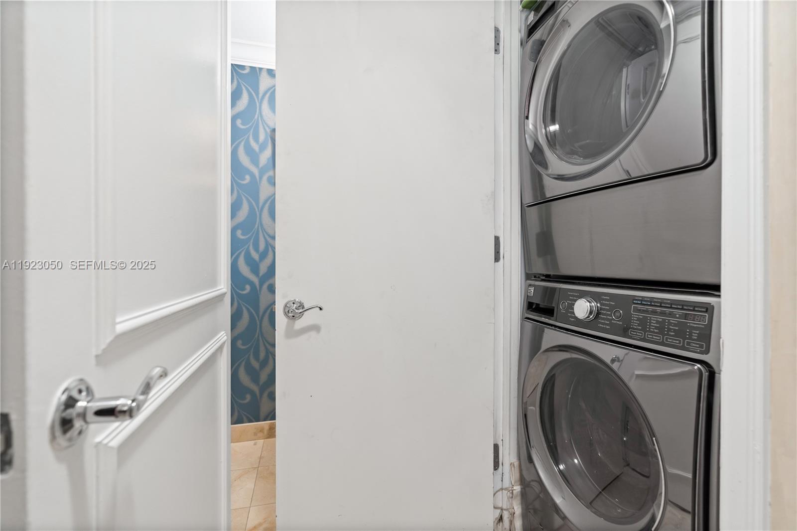 3350 Southwest 27th Avenue, Unit 1706 Coconut Grove, FL 33133 - Photo 19 of 32 a utility room with dryer and washer