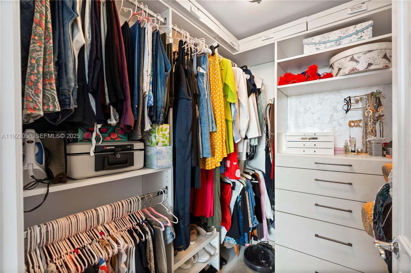 3350 Southwest 27th Avenue, Unit 1706 Coconut Grove, FL 33133 - Photo 20 of 32 a view of walk in closet with clothes