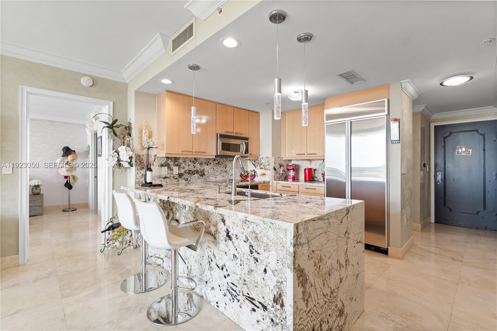 3350 Southwest 27th Avenue, Unit 1706 Coconut Grove, FL 33133 - Photo 7 of 32 a very nice looking dining room with kitchen island furniture a chandelier