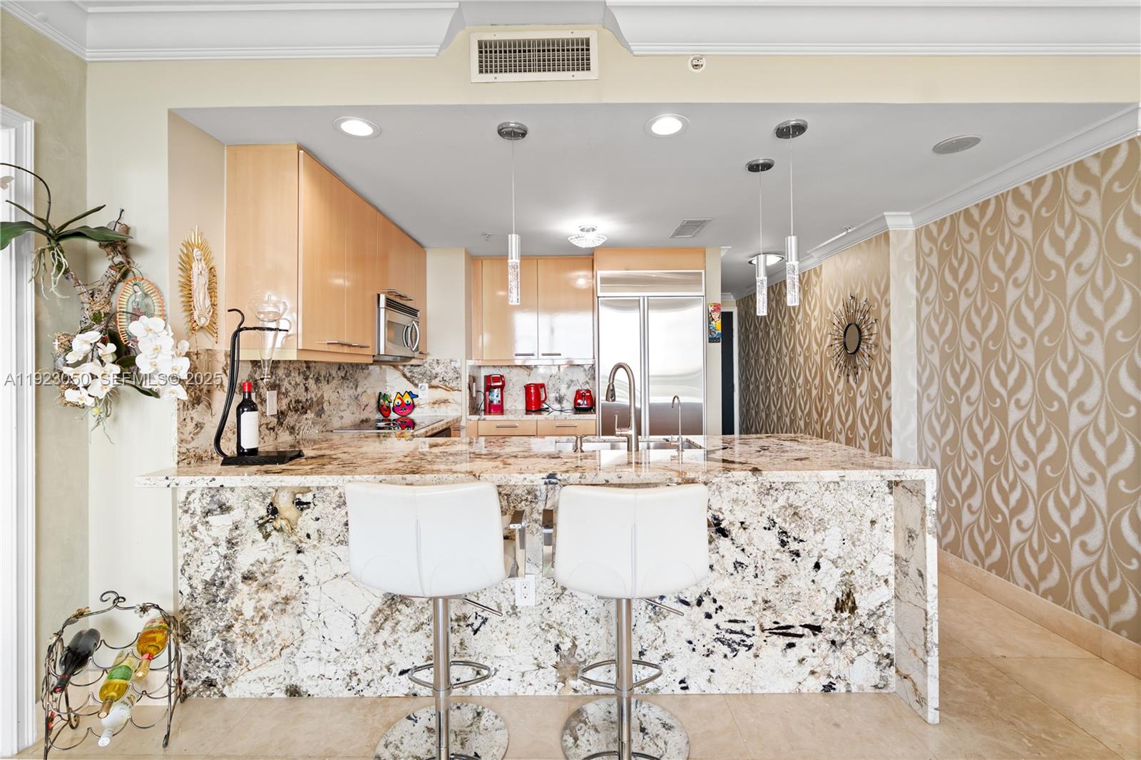 3350 Southwest 27th Avenue, Unit 1706 Coconut Grove, FL 33133 - Photo 8 of 32 a kitchen with stainless steel appliances kitchen island granite countertop a sink and cabinets