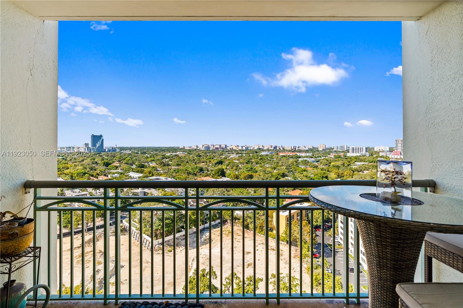 3350 Southwest 27th Avenue, Unit 1706 Coconut Grove, FL 33133 - Photo 9 of 32 a view of a balcony with furniture